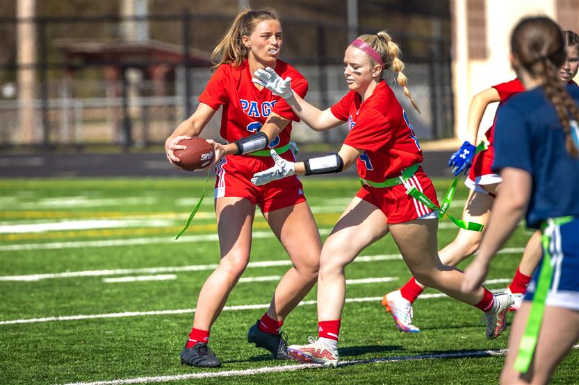 Students play flag football